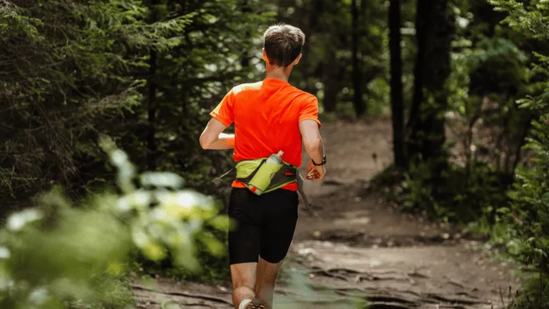 Adjustable waist belt with water bottle