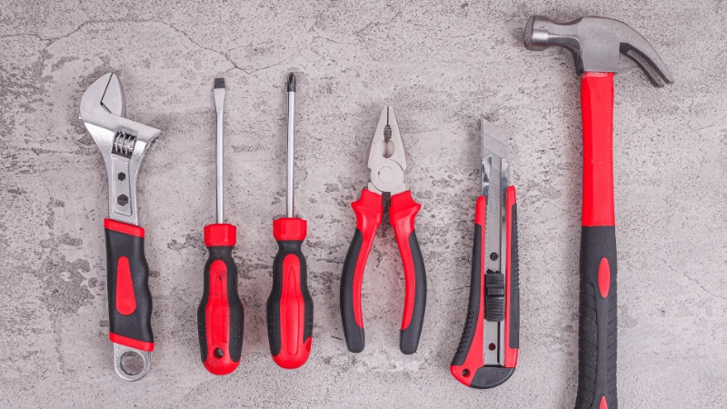 Screwdriver, hammer, pliers, wrench made by overmolding