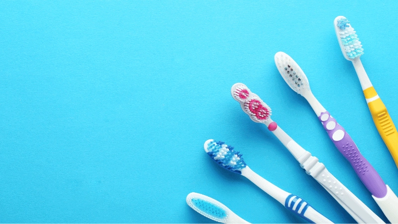 Toothbrush handles made by overmolding