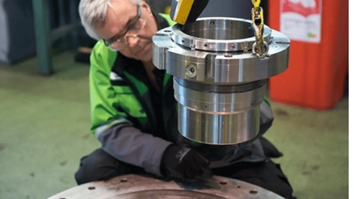 Professionals are inspecting the machine and actually operating its operation process.